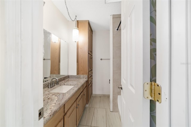 bathroom with tile patterned floors and vanity