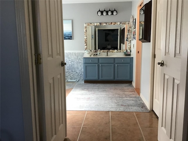 bathroom featuring tile patterned flooring and vanity