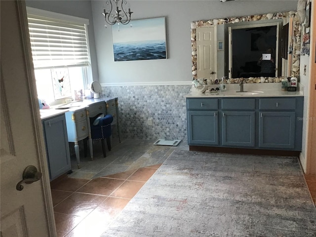 bathroom featuring vanity and an inviting chandelier