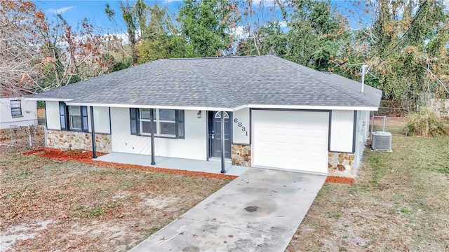 ranch-style house with central AC, covered porch, a front yard, and a garage