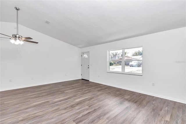 unfurnished living room featuring ceiling fan, dark wood-type flooring, and lofted ceiling