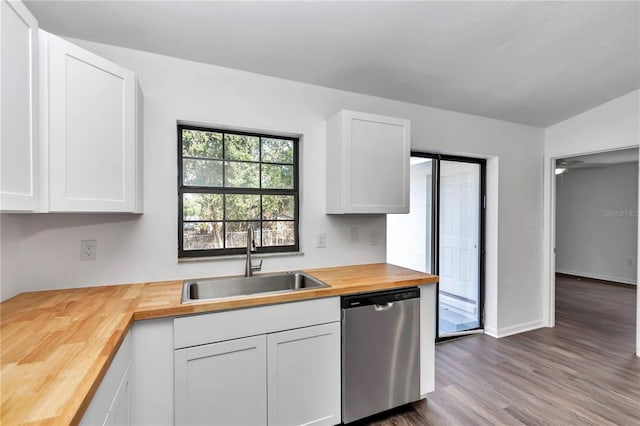 kitchen with wood counters, sink, wood-type flooring, dishwasher, and white cabinets