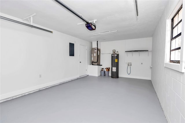 garage featuring heating unit, a garage door opener, and water heater