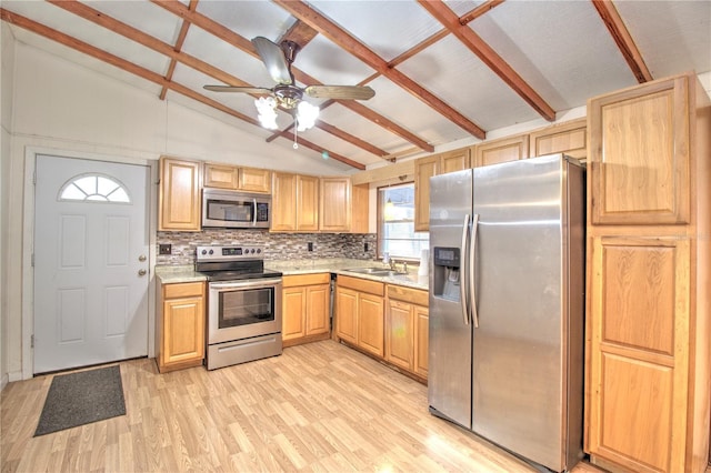 kitchen featuring light brown cabinets, vaulted ceiling with beams, decorative backsplash, light wood-type flooring, and appliances with stainless steel finishes