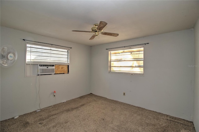 unfurnished room with carpet floors, ceiling fan, and cooling unit