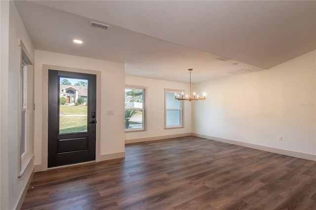 foyer featuring a chandelier and dark hardwood / wood-style floors