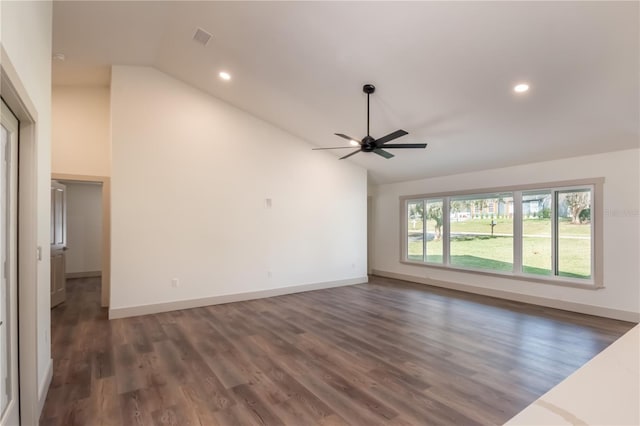 empty room featuring ceiling fan, high vaulted ceiling, and dark wood-type flooring