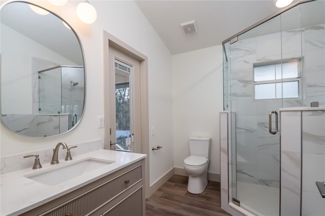 bathroom featuring an enclosed shower, toilet, vaulted ceiling, vanity, and hardwood / wood-style flooring