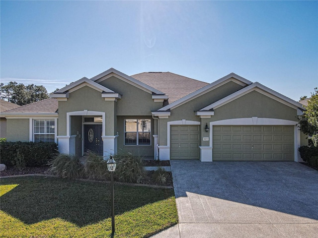 ranch-style house featuring a garage