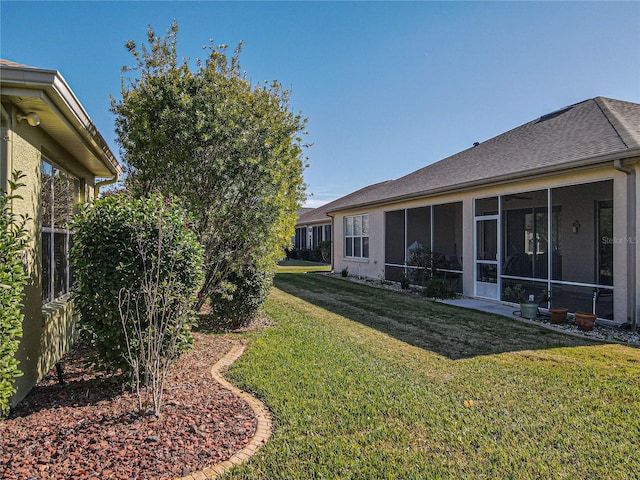 view of yard featuring a sunroom