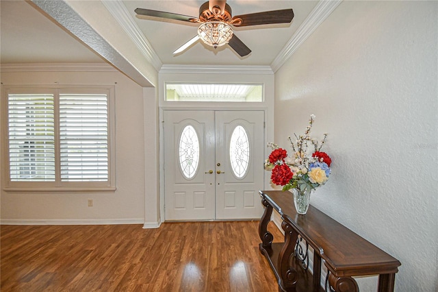 foyer entrance featuring hardwood / wood-style floors, ceiling fan, and crown molding