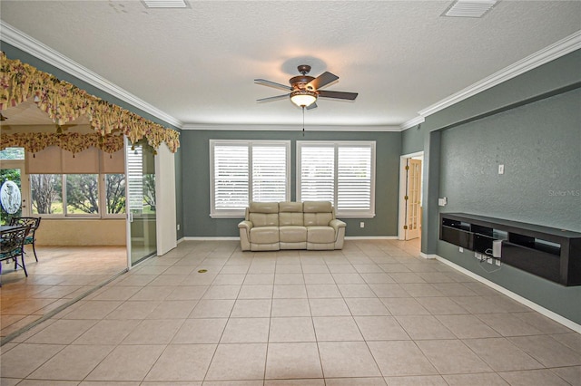 unfurnished room with a textured ceiling, ceiling fan, ornamental molding, and light tile patterned flooring