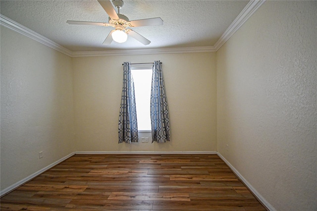 empty room featuring a textured ceiling, dark hardwood / wood-style flooring, ceiling fan, and crown molding