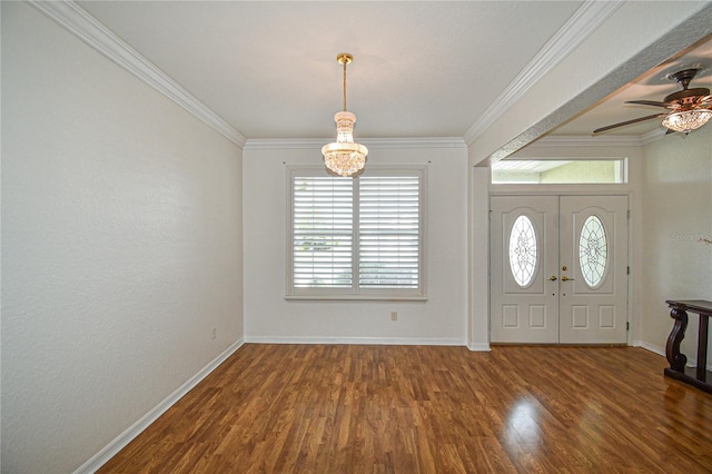 entrance foyer with crown molding, ceiling fan with notable chandelier, and dark hardwood / wood-style floors