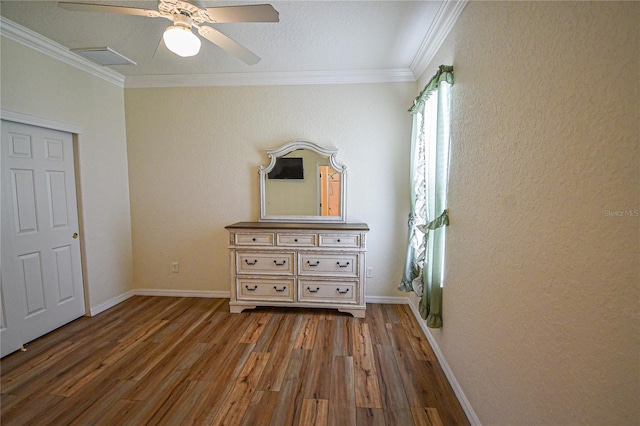 unfurnished bedroom with wood-type flooring, ceiling fan, and ornamental molding