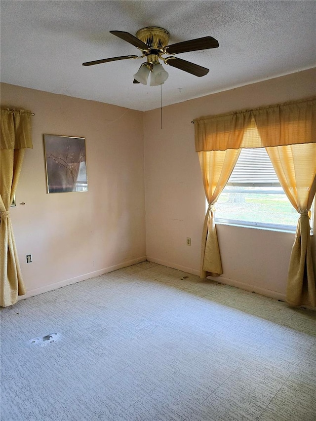 spare room with ceiling fan