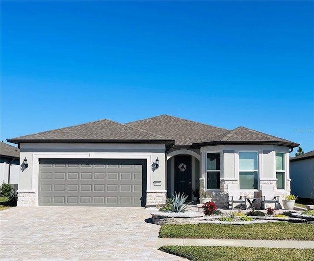 prairie-style house featuring a garage