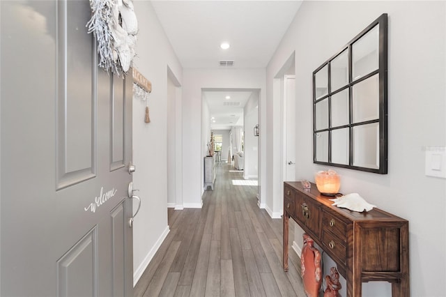 hallway featuring hardwood / wood-style flooring