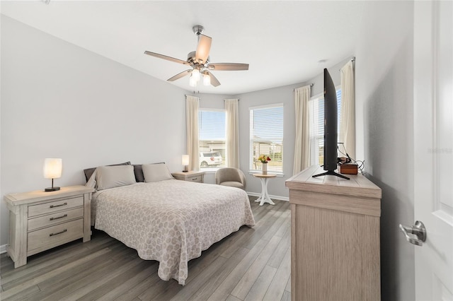 bedroom featuring dark hardwood / wood-style flooring and ceiling fan