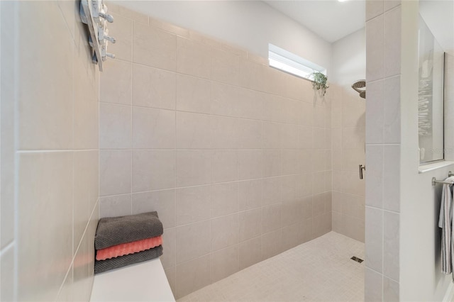 bathroom featuring tiled shower