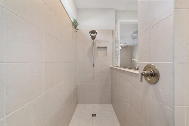 bathroom with a tile shower