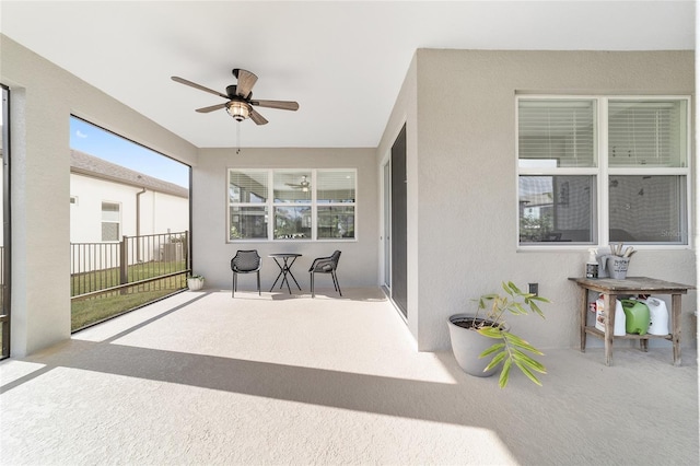 sunroom / solarium with ceiling fan