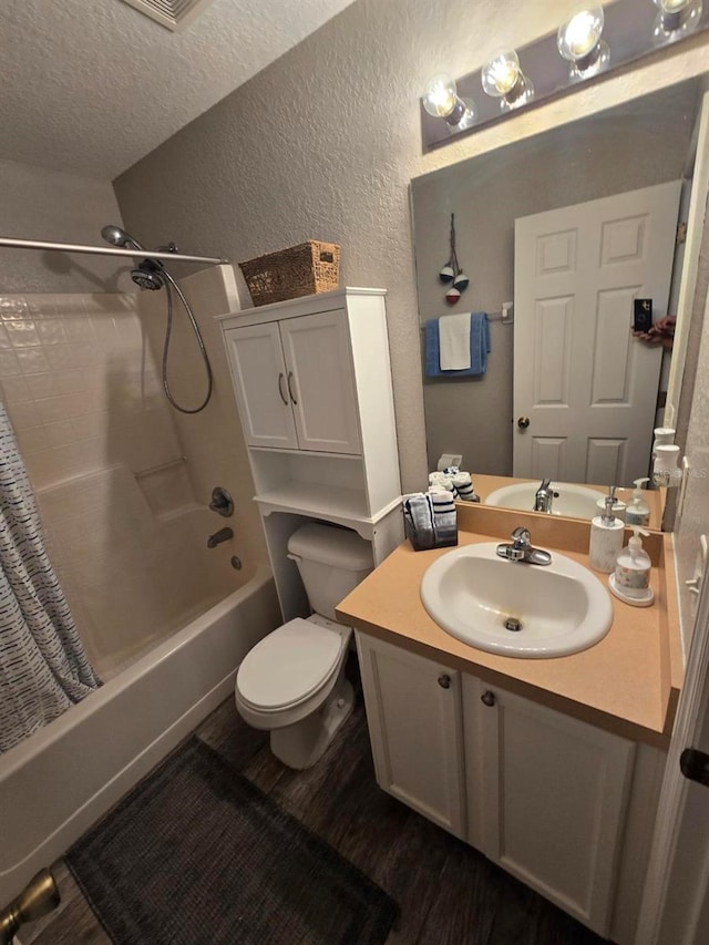 113 Guava Ter, Ocklawaha, FL 32179 - full bathroom with a textured wall, wood finished floors, shower / tub combo with curtain, vanity, and toilet