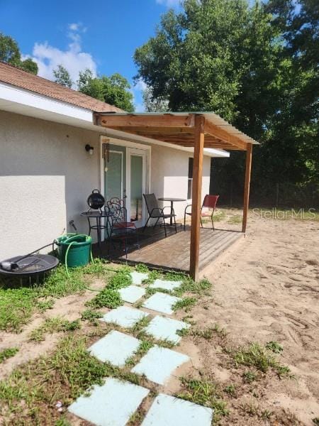 113 Guava Ter, Ocklawaha, FL 32179 - view of patio / terrace with a deck