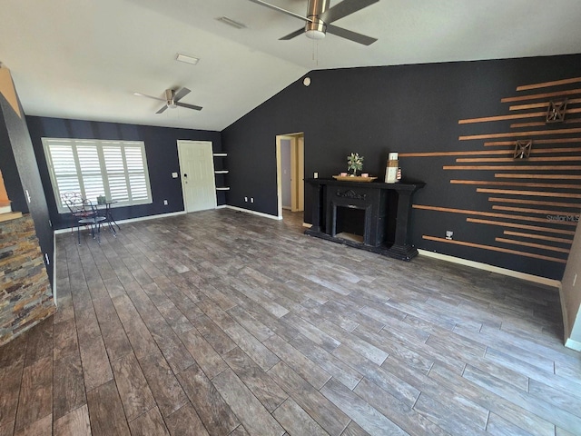 113 Guava Ter, Ocklawaha, FL 32179 - unfurnished living room featuring a ceiling fan, lofted ceiling, wood finished floors, and baseboards