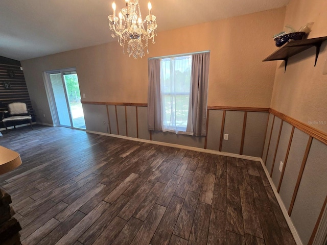 113 Guava Ter, Ocklawaha, FL 32179 - unfurnished living room with wood finished floors, a chandelier, and a wainscoted wall