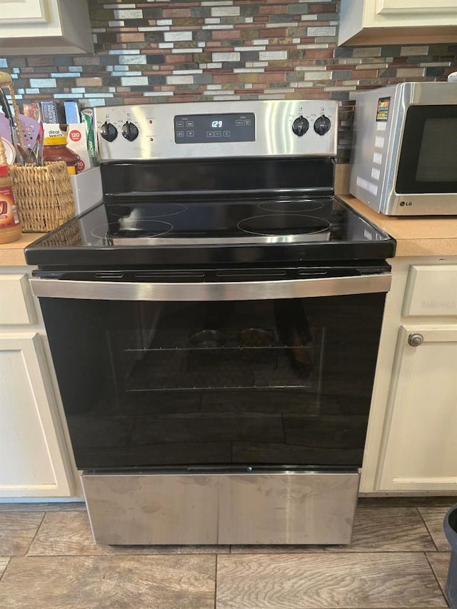 113 Guava Ter, Ocklawaha, FL 32179 - kitchen view of stainless steel appliances and light countertops