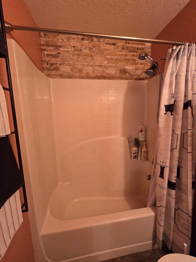 113 Guava Ter, Ocklawaha, FL 32179 - full bath with shower / bath combination with curtain, a textured ceiling, and toilet