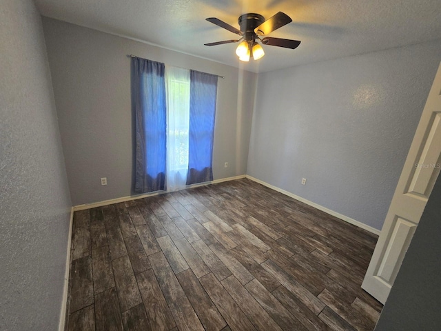 113 Guava Ter, Ocklawaha, FL 32179 - spare room with dark wood-style flooring, ceiling fan, a textured wall, and baseboards