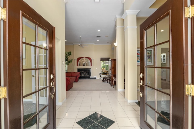 corridor with light tile patterned flooring and french doors