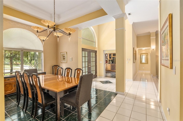 dining room featuring french doors, ornamental molding, a raised ceiling, light tile patterned floors, and a chandelier