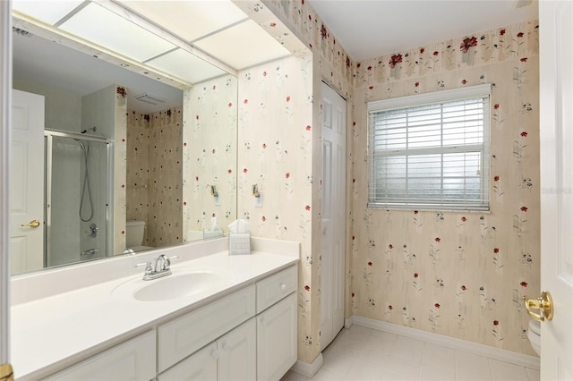 bathroom with vanity, toilet, and walk in shower