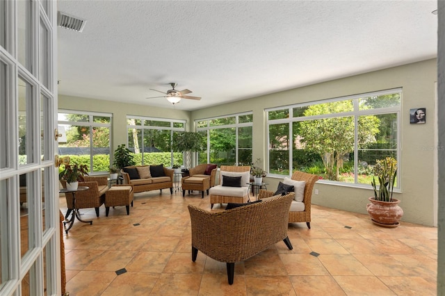 sunroom / solarium with ceiling fan