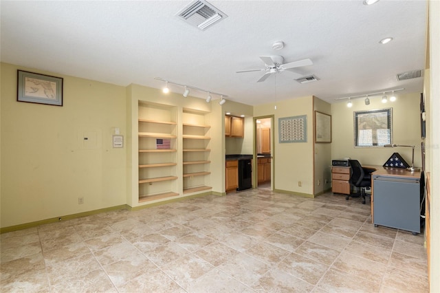 unfurnished living room featuring built in shelves, ceiling fan, and a textured ceiling