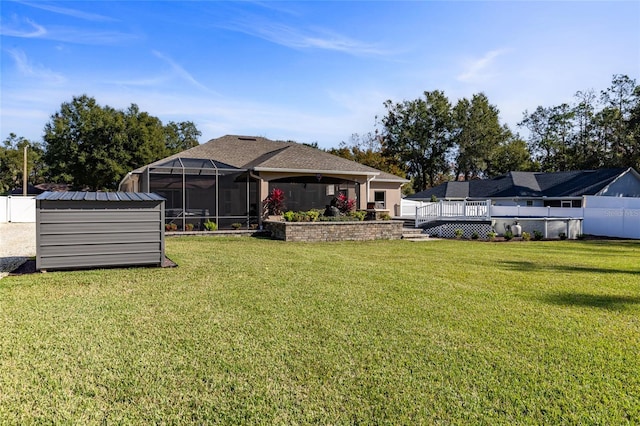 view of yard with a storage unit and a wooden deck