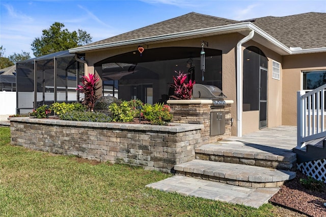 exterior space with a lawn, area for grilling, and a lanai