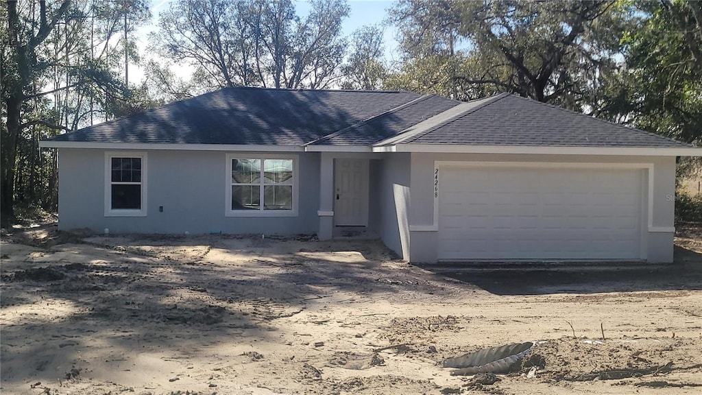 single story home featuring a garage