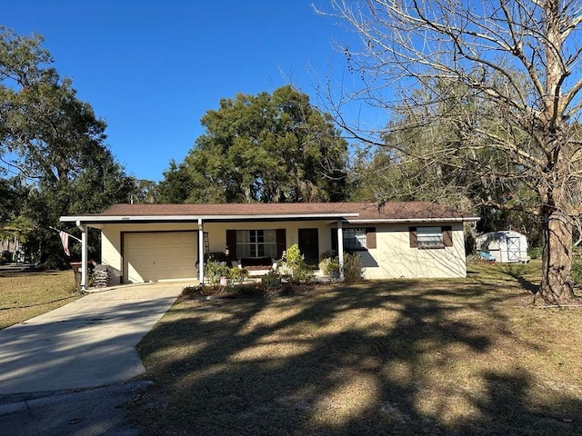 ranch-style home with a front yard, a shed, and a garage