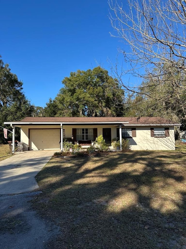 view of front of home with a garage and a front lawn