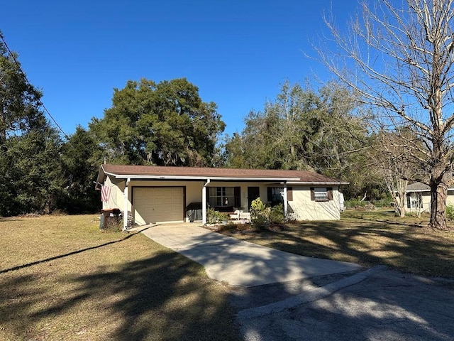 single story home featuring a porch, a garage, and a front lawn