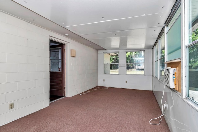 5507 SE 107th Pl, Belleview, FL 34420 - spare room with plenty of natural light, concrete block wall, and carpet