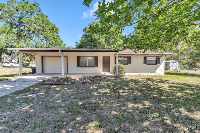 5507 SE 107th Pl, Belleview, FL 34420 - ranch-style house featuring a storage unit, a front lawn, concrete driveway, a garage, and stucco siding
