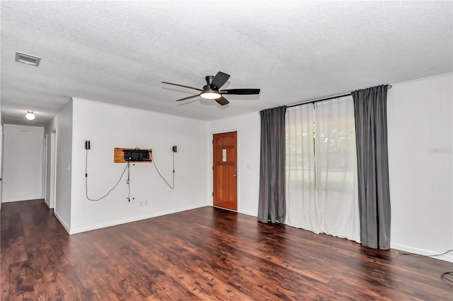 5507 SE 107th Pl, Belleview, FL 34420 - unfurnished living room with wood finished floors, visible vents, a textured ceiling, and ceiling fan
