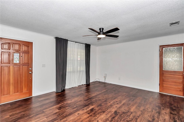 5507 SE 107th Pl, Belleview, FL 34420 - interior space with a textured ceiling, ceiling fan, dark wood finished floors, baseboards, and visible vents