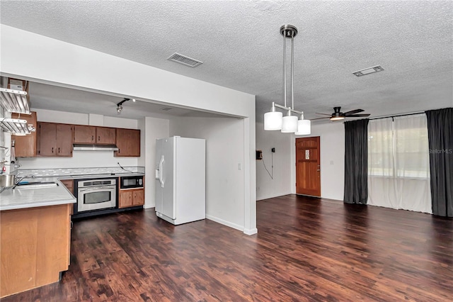 5507 SE 107th Pl, Belleview, FL 34420 - kitchen featuring oven, a sink, visible vents, white refrigerator with ice dispenser, and black microwave