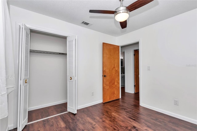 5507 SE 107th Pl, Belleview, FL 34420 - unfurnished bedroom with baseboards, visible vents, wood finished floors, a closet, and ceiling fan
